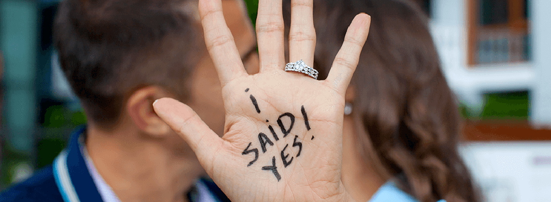 Engaged Couple Kissing with 