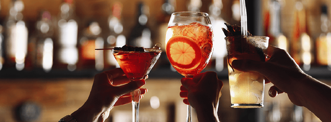 3 People Cheersing their Cocktails