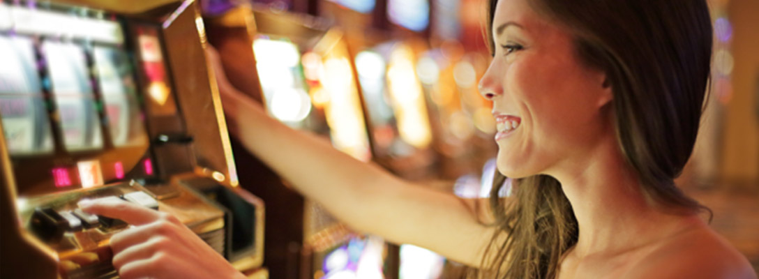 Happy Woman Playing Slots in Las Vegas