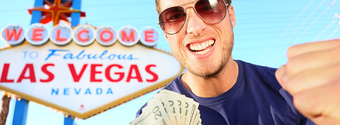 Man Holding $100 for Las Vegas on a Budget