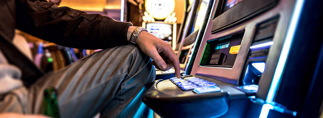 Man Playing Slots in Las Vegas