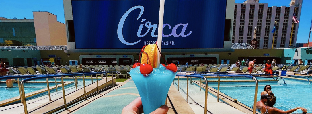 Person Holding 100 oz Drink in Las Vegas at Stadium Swim